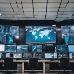 cyber security monitoring center with digital screens and alerts