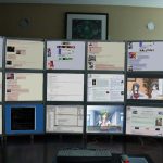 confused person looking at a computer screen with a landing page, modern office background