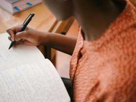 person using writing tools on a computer
