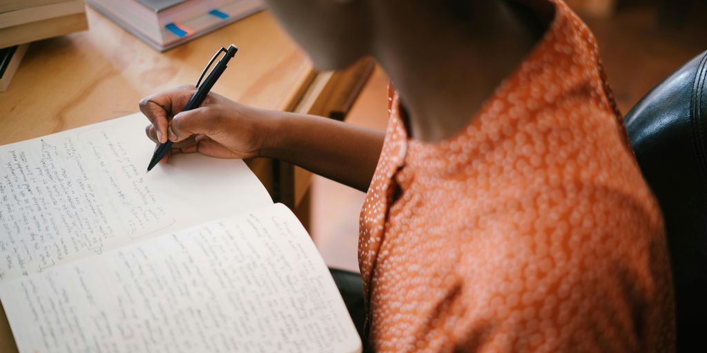 person using writing tools on a computer